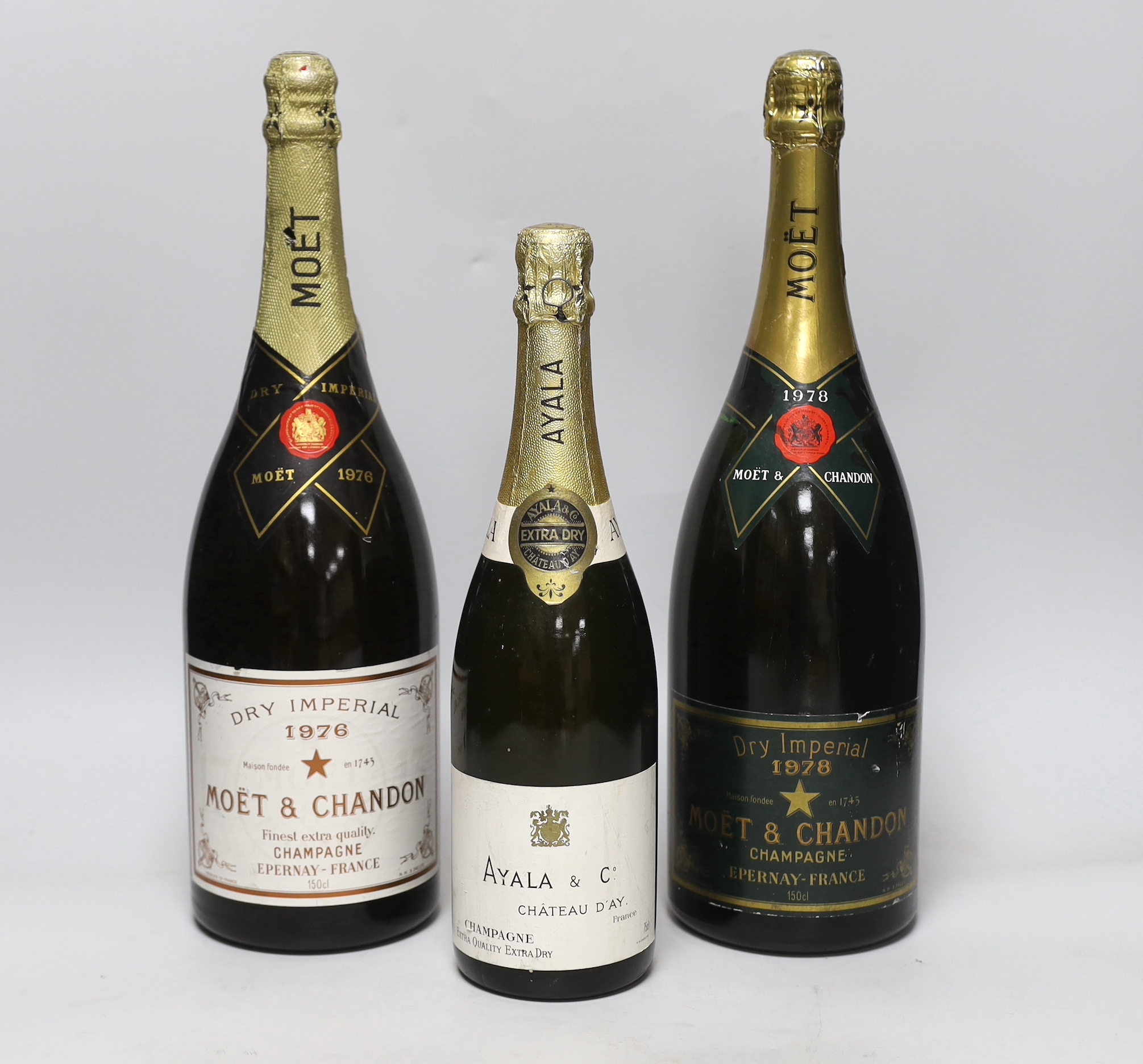 A bottle of Ayala & Co, Chateau D'ay Champagne, a magnum of Moet et Chandon champagne 1978 and a magnum of Moet et Chandon champagne 1976